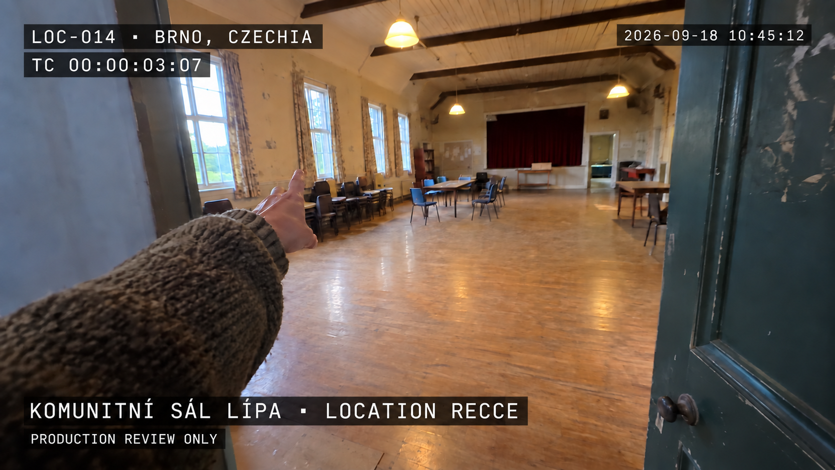 Location scouting mockup for Komunitní sál Lípa in Brno, Czechia, with timecode and production-review slate